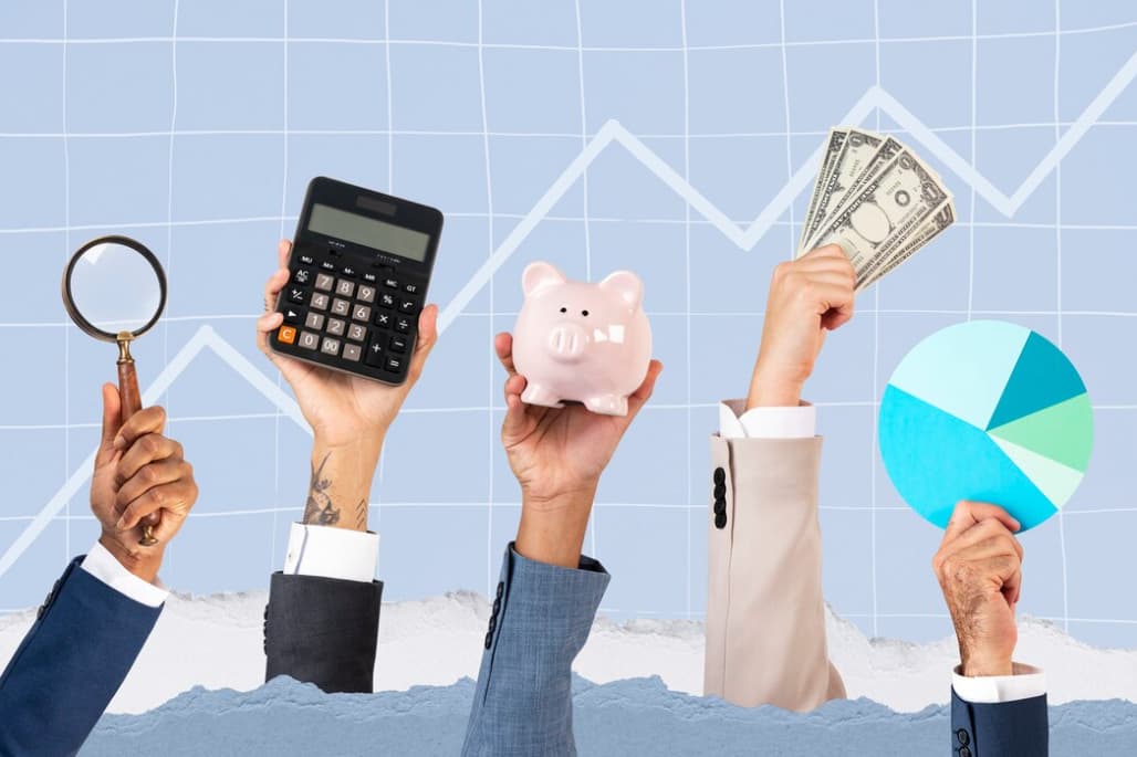 Hands holding financial items: calculator, piggy bank, money, and pie chart