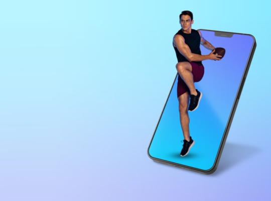A man merges from a smartphone screen holding a football