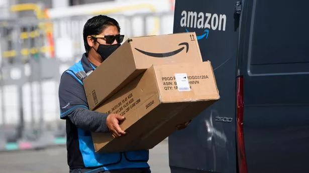 A man delivers packages from Amazon
