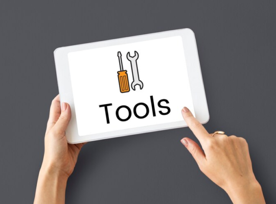 Holding Tablet with Tools on Screen