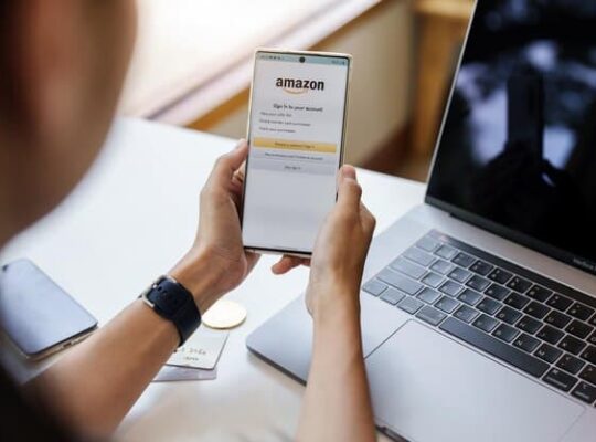 The man is shopping on the Amazon app