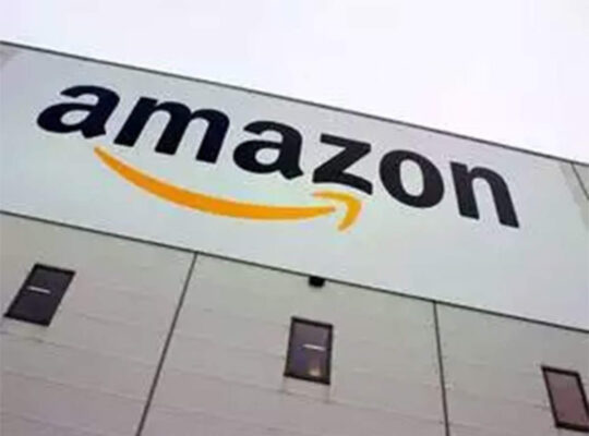 The wall of the building with the Amazon logo on it